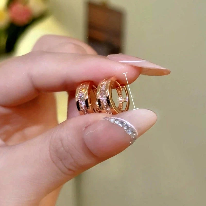 Model showcasing the dangle and style of the 14K Gold-Plated Elegant Zircon Diamond Little Hoop Earrings