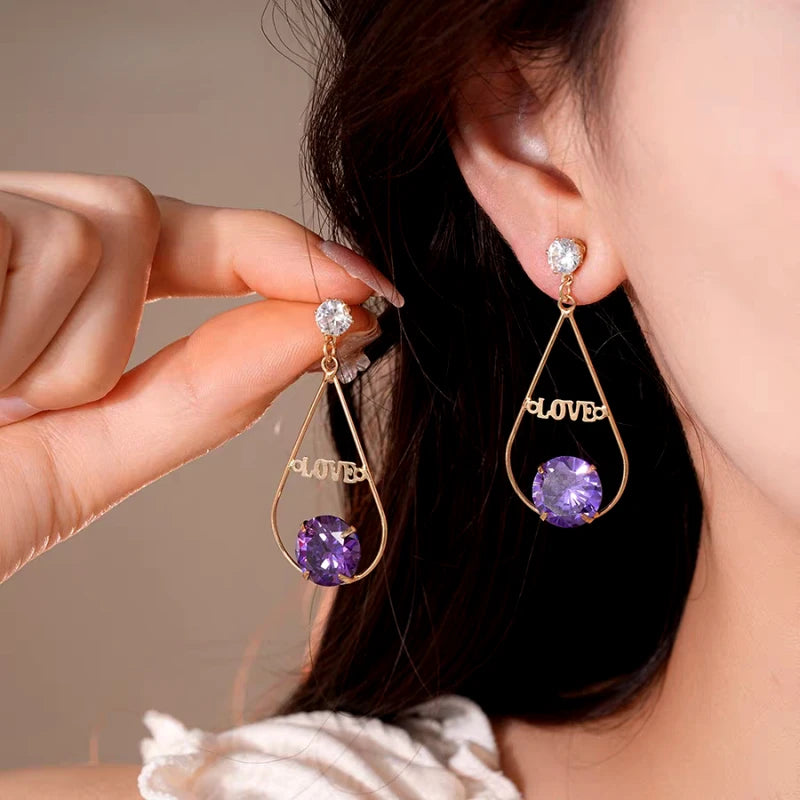 Close-up detail of the sparkling zircons and plating on the Tassel Earrings