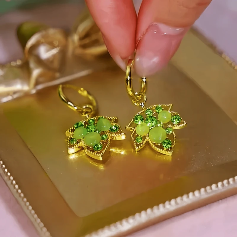Close-up detail of the sparkling zircons and plating on the Maple Leaf Earrings