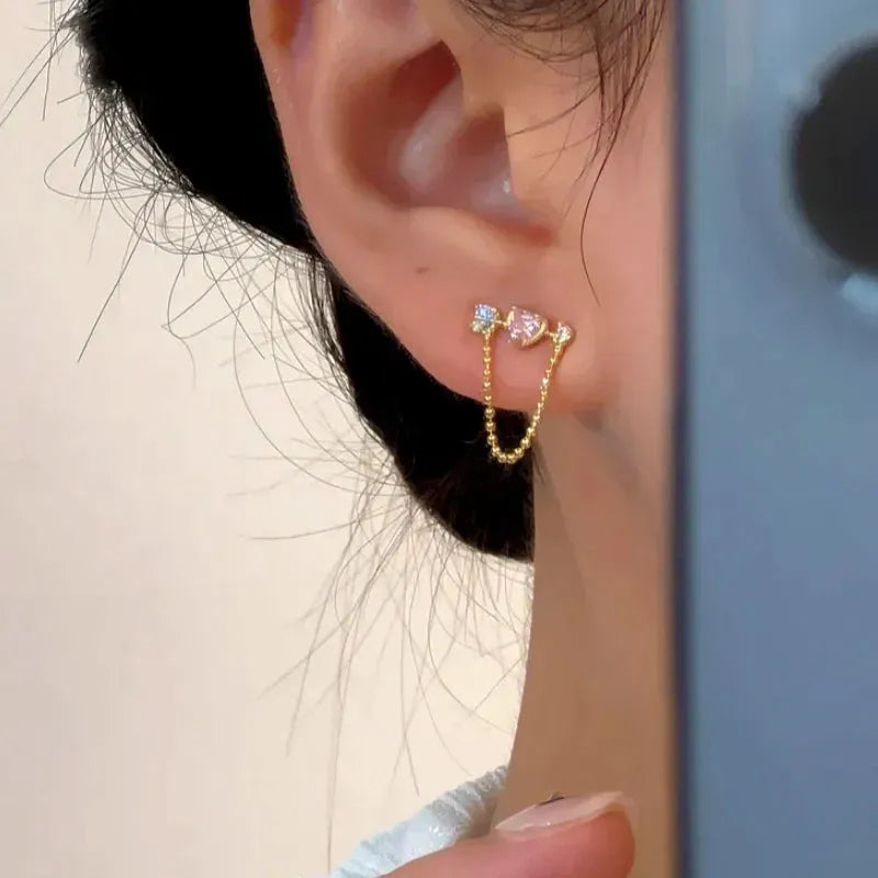 Close-up detail of the sparkling zircons and plating on the Sword Earrings