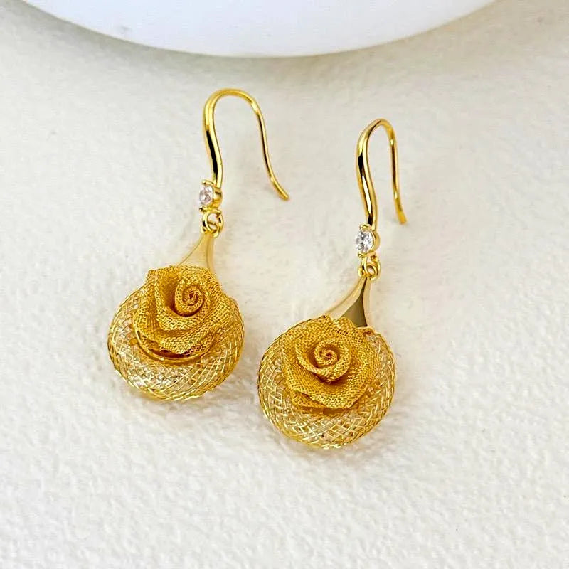 Close-up detail of the sparkling zircons and plating on the Rose Ear Hooks