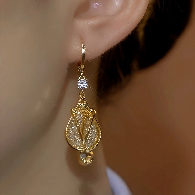 Close-up detail of the sparkling zircons and plating on the Tulip Earrings
