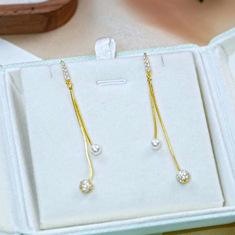 Angled view of the 14K Gold-Plated Elegant Zircon Diamond Pearl Ball Ear Hooks