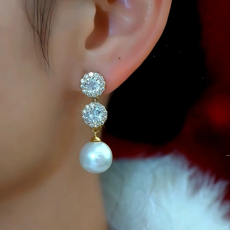 Model showcasing the dangle and style of the 14K Gold-Plated Elegant Zircon Diamond Pearl Earrings