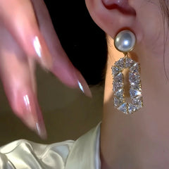 Close-up detail of the sparkling zircons and plating on the Pearl Dangle Earrings