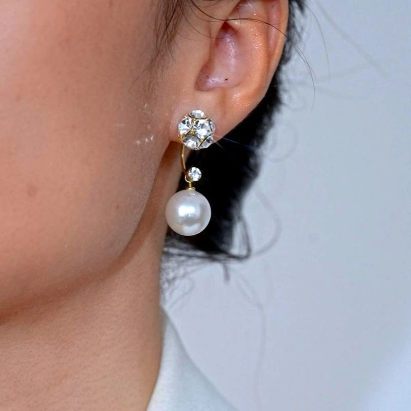 Close-up detail of the sparkling zircons and plating on the Pearl Jacket Earrings