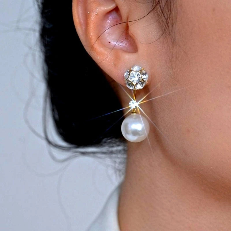 Model showcasing the dangle and style of the 14K Gold-Plated Elegant Zircon Diamond Pearl Jacket Earrings