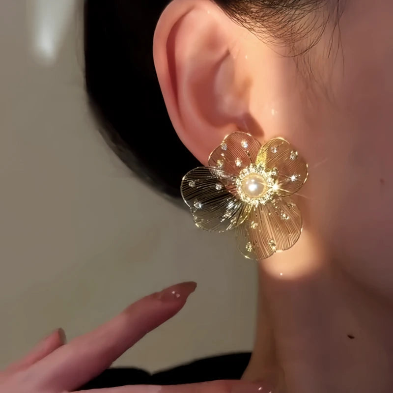 Close-up detail of the sparkling zircons and plating on the Flower Stud Earrings