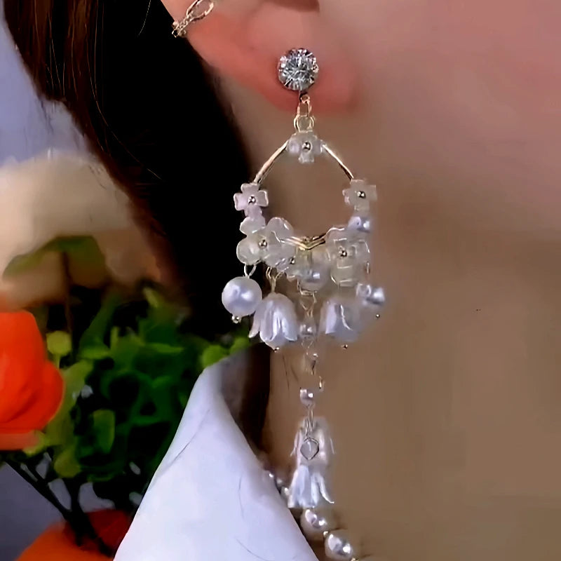 Close-up detail of the sparkling zircons and plating on the Tassel Earrings