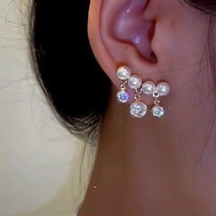 Close-up detail of the sparkling zircons and plating on the Tassel Earrings