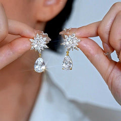 Angled view of the 14K Gold-Plated Elegant Zircon Diamond Petal Flower Water Drop Earrings