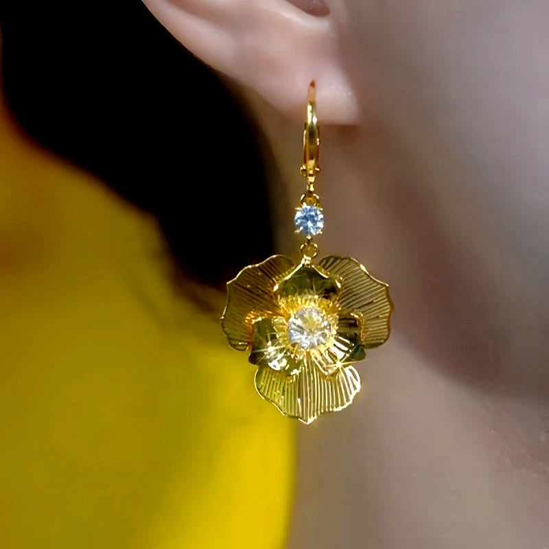 Model showcasing the dangle and style of the 14K Gold-Plated Elegant Zircon Diamond Rose Earrings
