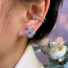 Model showcasing the dangle and style of the 14K Gold-Plated Elegant Zircon Diamond Rotatable Windmill Earrings
