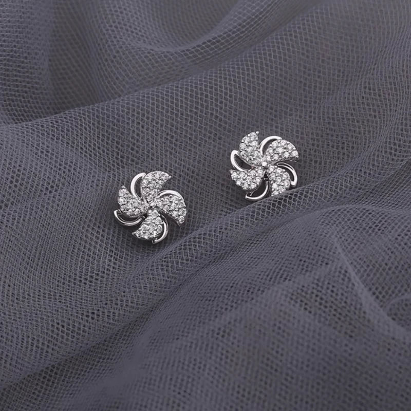 Angled view of the 14K Gold-Plated Elegant Zircon Diamond Rotatable Windmill Earrings