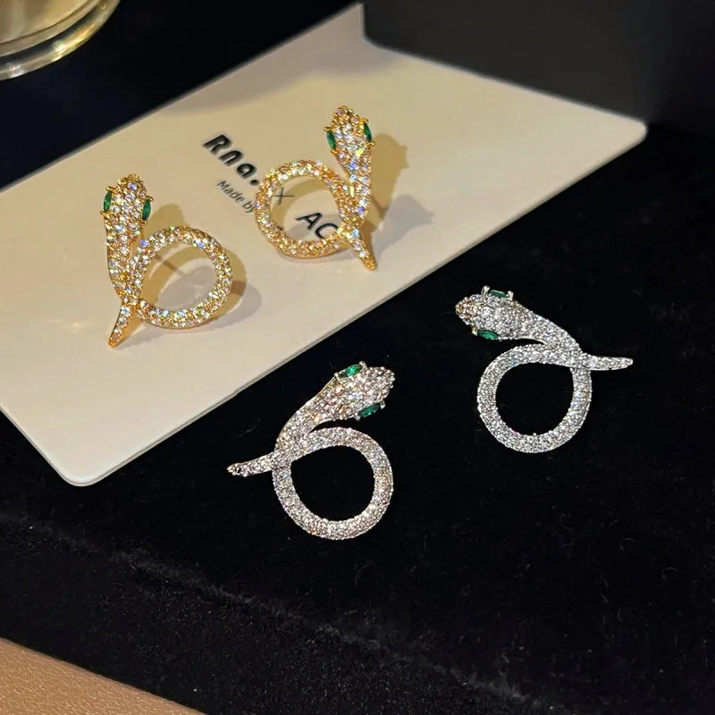 Model showcasing the dangle and style of the 14K Gold-Plated Elegant Zircon Diamond Snake Earrings