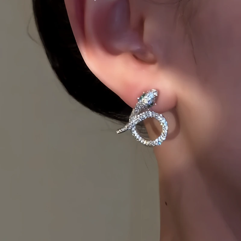 Angled view of the 14K Gold-Plated Elegant Zircon Diamond Snake Earrings