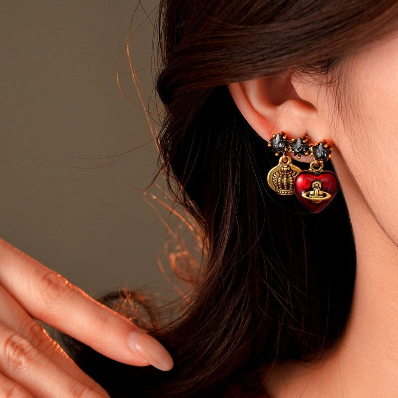 Model showcasing the dangle and style of the 14K Gold-Plated Elegant Zircon Diamond Star And Heart Saturn Earrings