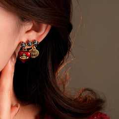 Close-up detail of the sparkling zircons and plating on the Saturn Earrings