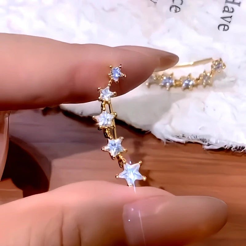 Close-up detail of the sparkling zircons and plating on the Star Crawler Earrings