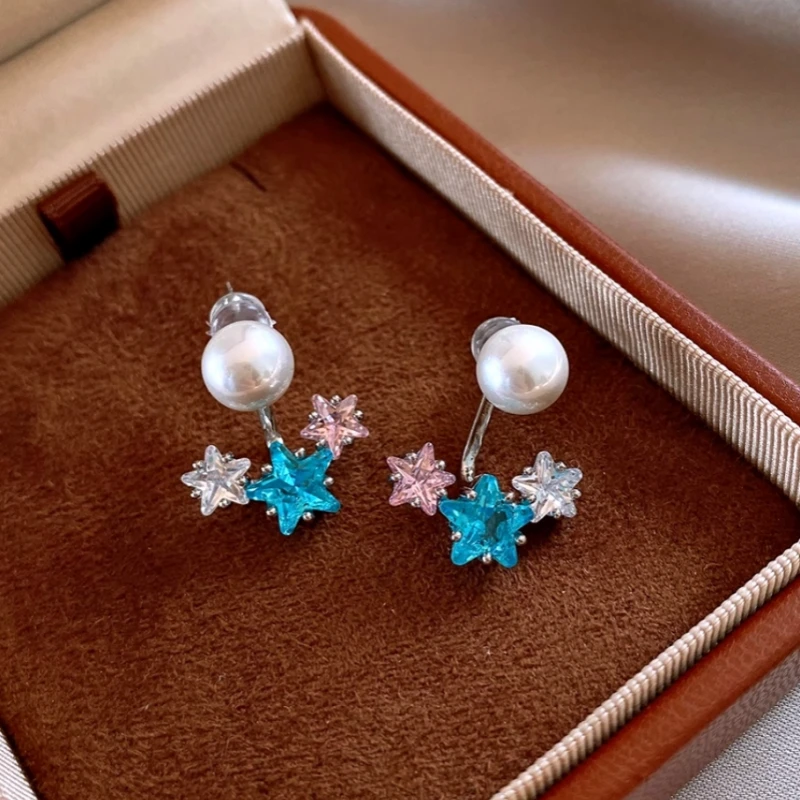 Close-up detail of the sparkling zircons and plating on the Jacket Earrings