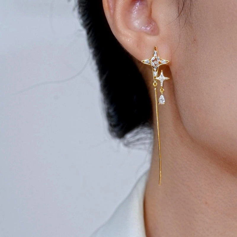 Model showcasing the dangle and style of the 14K Gold-Plated Elegant Zircon Diamond Star Tassel Earrings