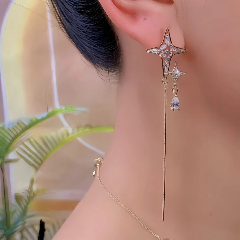 Model showcasing the dangle and style of the 14K Gold-Plated Elegant Zircon Diamond Star Tassel Earrings