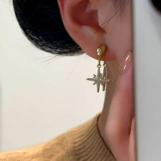 Model showcasing the dangle and style of the 14K Gold-Plated Elegant Zircon Diamond Star Tassel Earrings