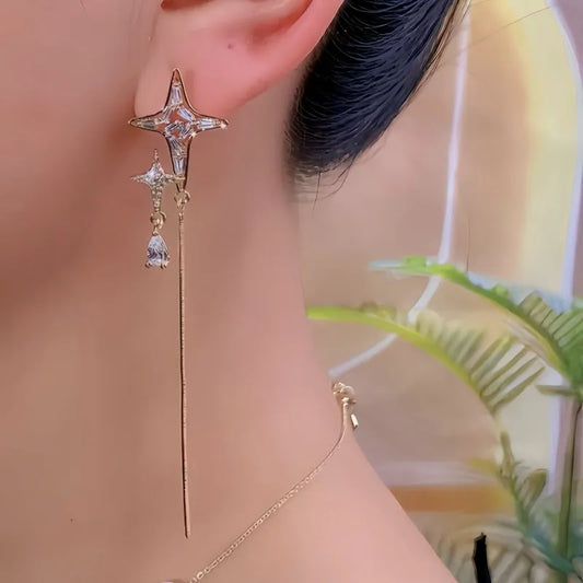 Model showcasing the dangle and style of the 14K Gold-Plated Elegant Zircon Diamond Star Tassel Earrings