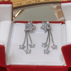 Close-up detail of the sparkling zircons and plating on the Star Tassel Earrings