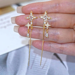 Angled view of the 14K Gold-Plated Elegant Zircon Diamond Star Tassel Earrings