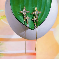 Angled view of the 14K Gold-Plated Elegant Zircon Diamond Star Tassel Earrings