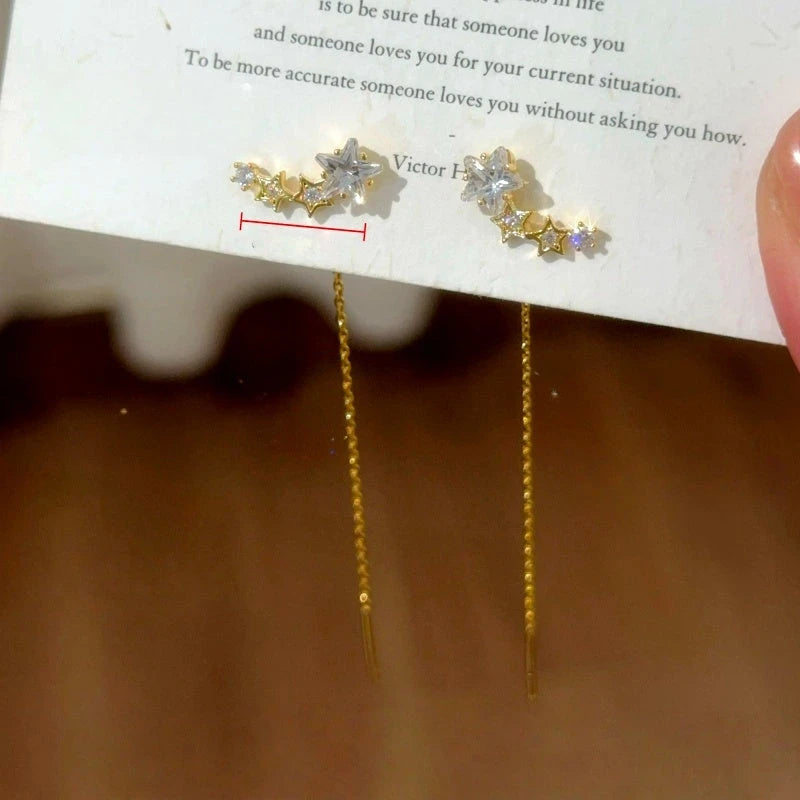 Model showcasing the dangle and style of the 14K Gold-Plated Elegant Zircon Diamond Star Threader Earrings