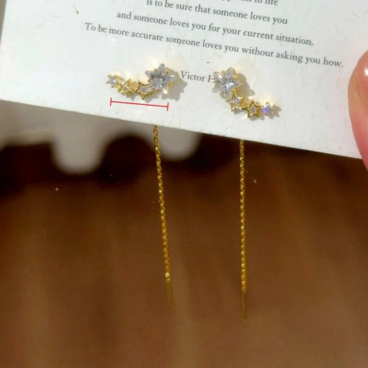 Model showcasing the dangle and style of the 14K Gold-Plated Elegant Zircon Diamond Star Threader Earrings