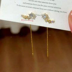 Model showcasing the dangle and style of the 14K Gold-Plated Elegant Zircon Diamond Star Threader Earrings