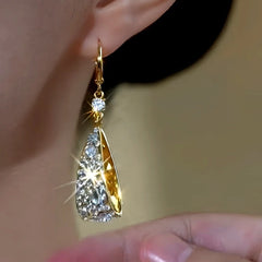 Model showcasing the dangle and style of the 14K Gold-Plated Elegant Zircon Diamond Tassel Earrings