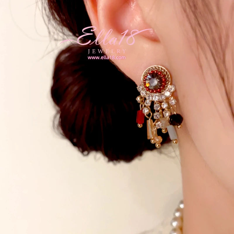 Close-up detail of the sparkling zircons and plating on the Tassel Earrings