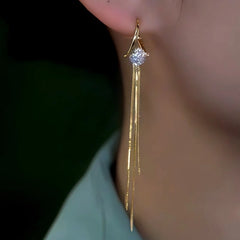 Close-up detail of the sparkling zircons and plating on the Dainty Tassel Earrings