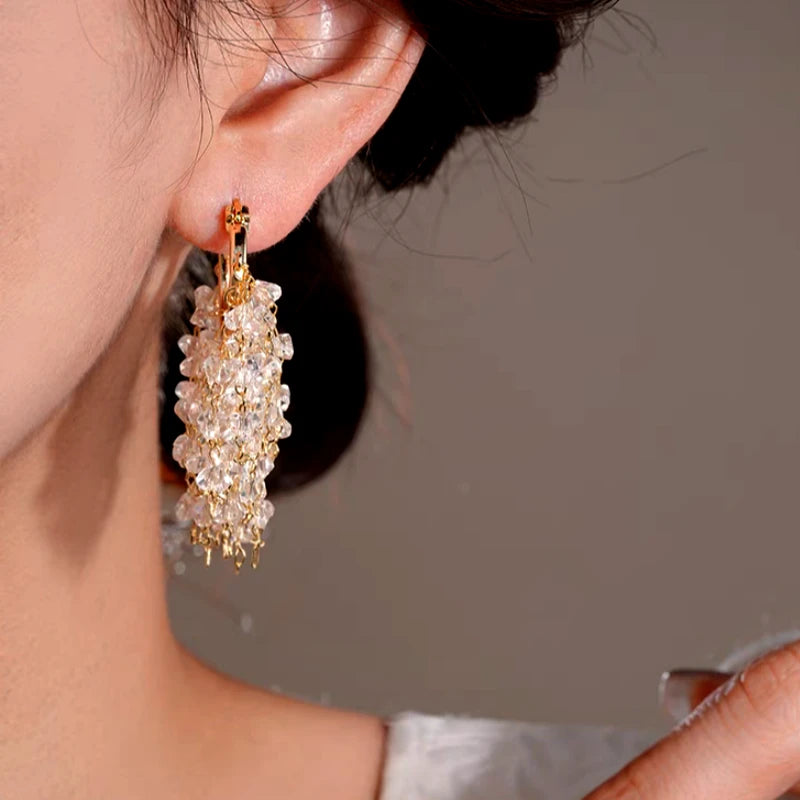 Close-up detail of the sparkling zircons and plating on the Gold Tassel Earrings