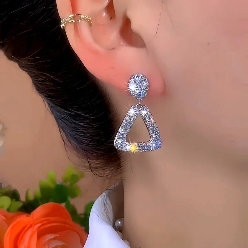 Close-up detail of the sparkling zircons and plating on the Gold Tassel Earrings