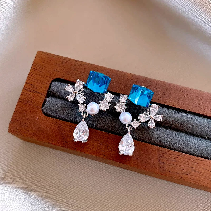 Close-up detail of the sparkling zircons and plating on the Blue Tassel Earrings