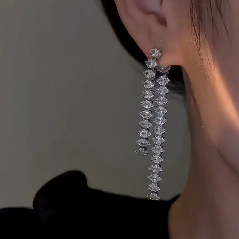 Close-up detail of the sparkling zircons and plating on the Tassel Earrings