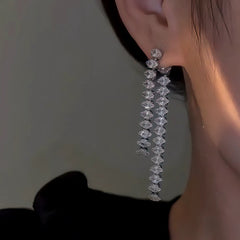 Close-up detail of the sparkling zircons and plating on the Tassel Earrings