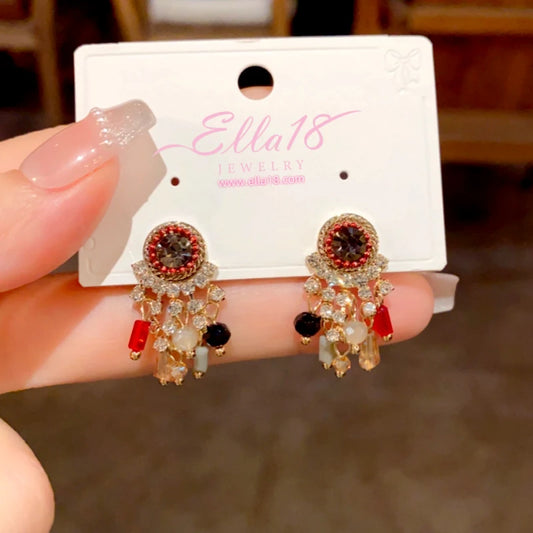 Model showcasing the dangle and style of the 14K Gold-Plated Elegant Zircon Diamond Tassel Earrings