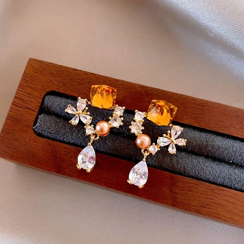 Angled view of the 14K Gold-Plated Elegant Zircon Diamond Tassel Earrings