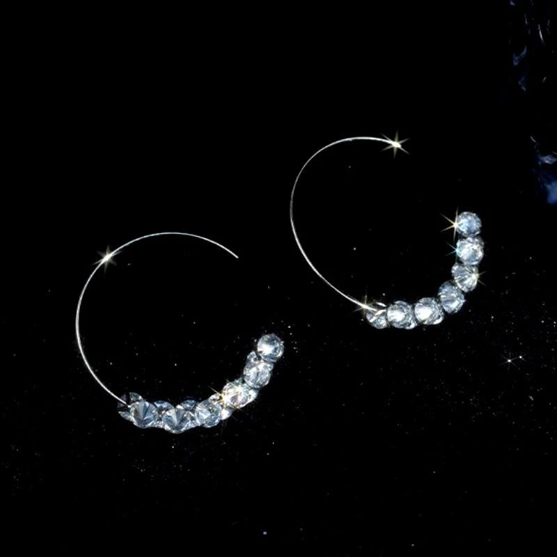 Model showcasing the dangle and style of the 14K Gold-Plated Elegant Zircon Diamond Threader Earrings