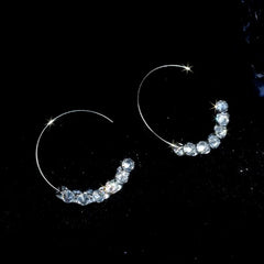 Model showcasing the dangle and style of the 14K Gold-Plated Elegant Zircon Diamond Threader Earrings