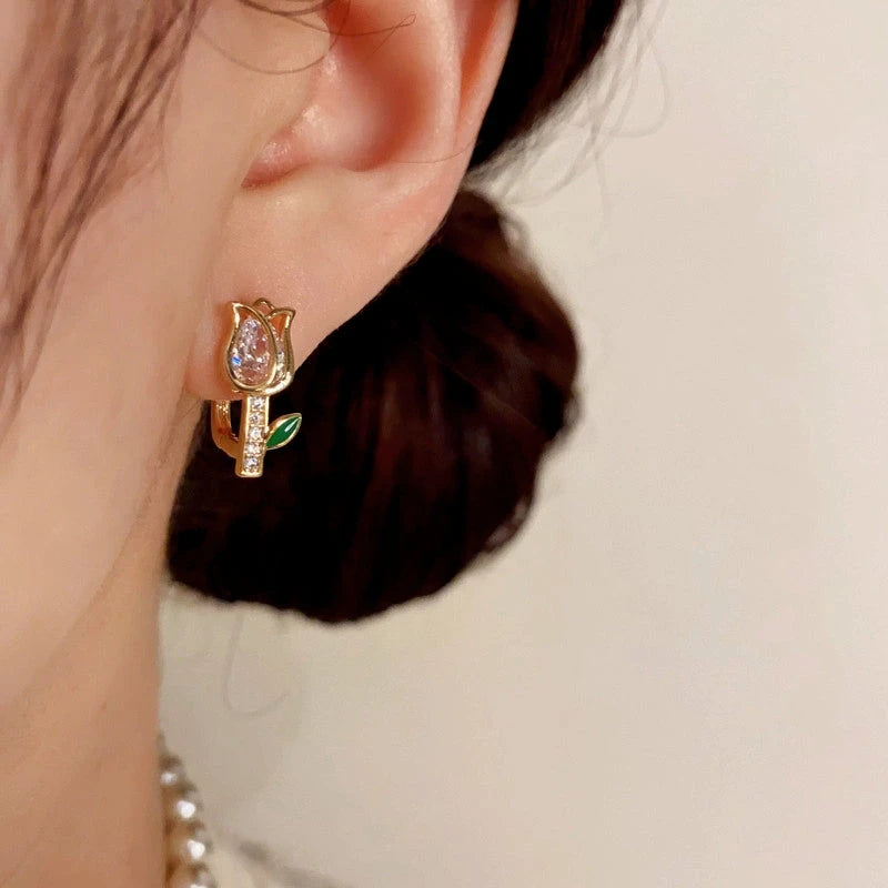 Model showcasing the dangle and style of the 14K Gold-Plated Elegant Zircon Diamond Tulip Earrings