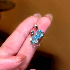 Model showcasing the dangle and style of the 14K Gold-Plated Elegant Zircon Diamond Water Drop Earrings