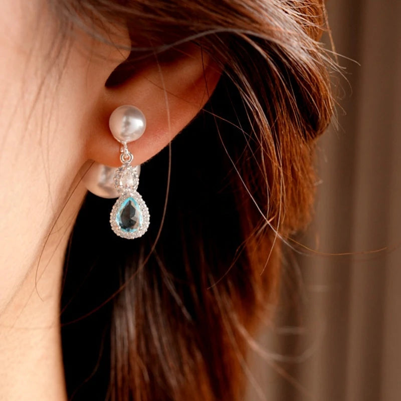 Close-up detail of the sparkling zircons and plating on the Pearl Jacket Earrings