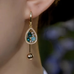 Close-up detail of the sparkling zircons and plating on the Water Drop Tassel Earrings